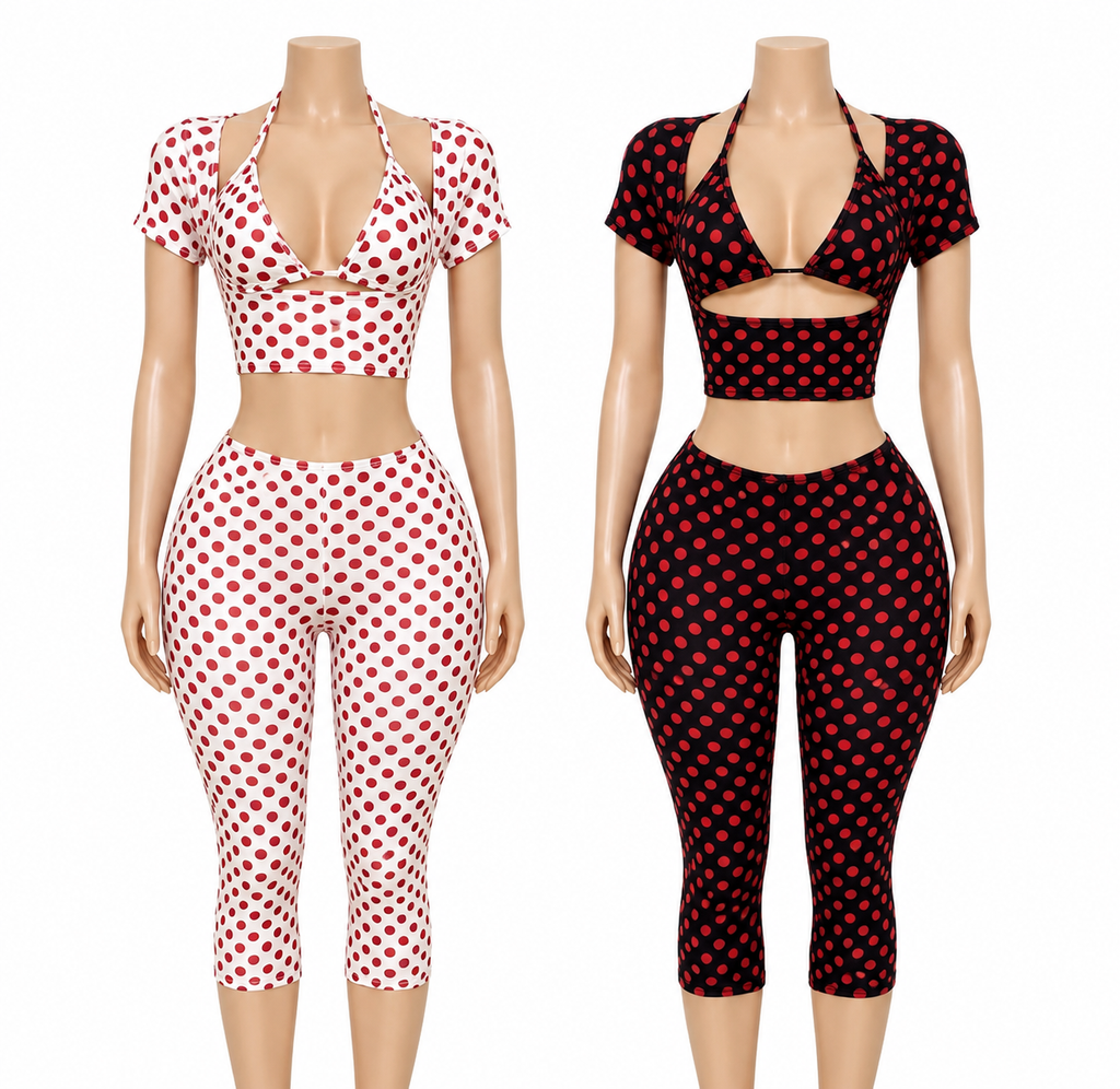 Two mannequin torsos wearing matching two-piece outfits with short-sleeve halter crop tops and high-waisted capri leggings in polka-dot patterns. The left outfit is white with red polka dots, and the right outfit is black with red polka dots.
